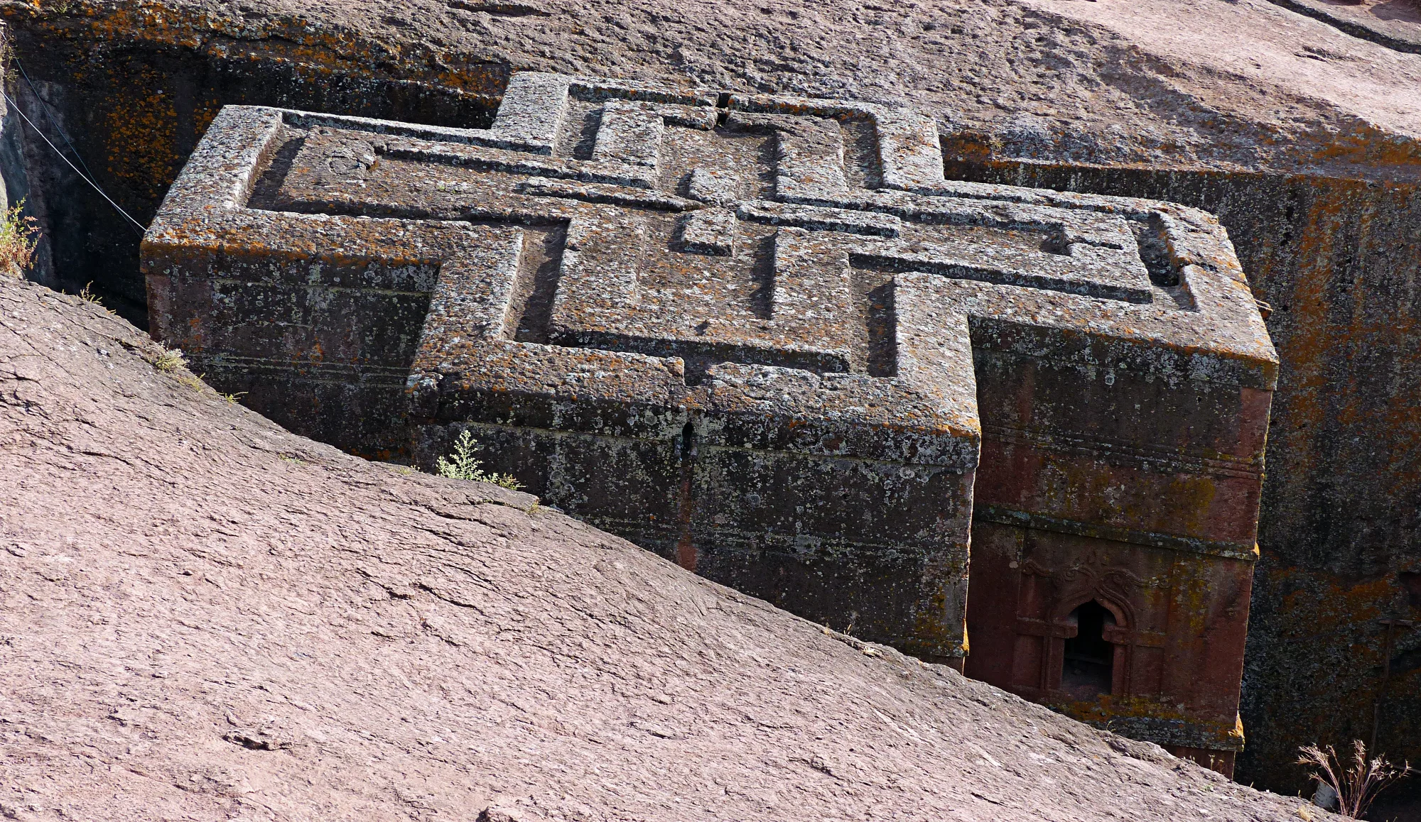 Rock-hewn monolithic church of Biete Giyorgis carved into red volcanic stone in Lalibela, Ethiopia